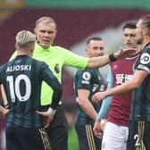 FLASHPOINT: Ezgjan Alioski is spoken to about a gesture at Turf Moor which the authorities have decided was misinterpreted