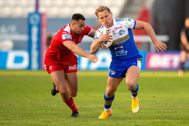 New deal: Hull KR's Luis Johnson in action against Brad Dwyer of his hometown club, Leeds Rhinos. Picture Bruce Rollinson