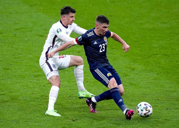 Close contact: England's Mason Mount and Scotland's Billy Gilmour battle for the ball.