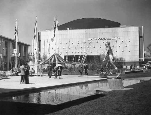 12th May 1951:  Visitors stroll outside the Royal Festival Hall on the South Bank, London during the Festival of Britain..  (Photo by Frank Harrison/Topical Press Agency/Getty Images)