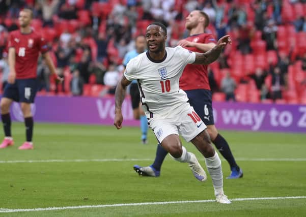 England's Raheem Sterling celebrates after scoring his side's winning goal. (AP Photo/Laurence Griffiths, Pool)