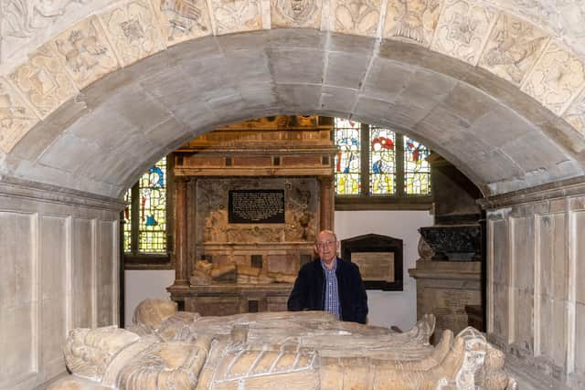 Brian Pearson, Chairman of The Fabric Group of Thornhill Parish Church next to The tomb of Sir George Savile (d. 1614) and his wife Anne, marked by a massive Renaissance monument. Image: James Hardisty