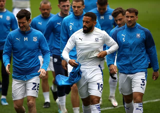 Tranmere Rovers' Liam Feeney (centre), David Nugent and Liam Ridehalgh warming up last season. Picture: PA