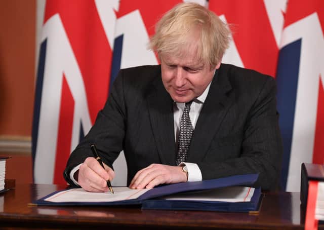 This was Boris Johnson signing the Brexit deal with the EU on December 30 last year.