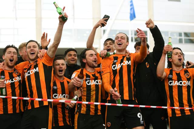 Hull City's players celebrate with their fans outside KCOM Stadium. Picture : Jonathan Gawthorpe