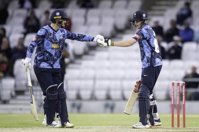 Record breakers:  Yorkshire's Jordan Thompson and Harry Brook punch gloves on their way to an English record sixth-wicket T20 stand of 141. Picture by Allan McKenzie/SWpix.com