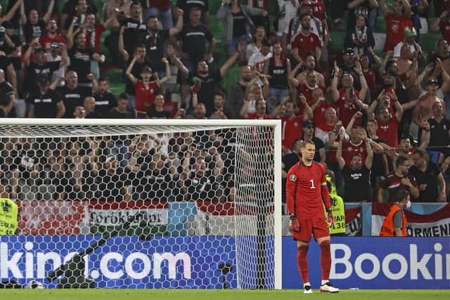 Germany's goalkeeper Manuel Neuer stands in front of the Hungary block. (Kai Pfaffenbach/Pool via AP)