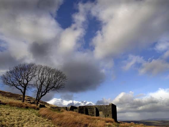 Top Withens high on the Pennine Moors above Haworth, the ruins have long been associated with the Bronte's as the home of the Earnshaw's in Emily Bronte's novel 'Wuthering Heights'. Image by Bruce Rollinson