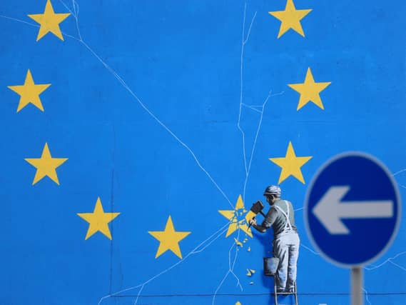 File photo dated dated 29/01/19 of a view of the Brexit-inspired mural by artist Banksy. Wednesday marks five years since the UK voted to leave the EU by 52% to 48% - however, the path out of Europe has been anything but smooth.