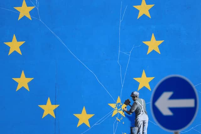 File photo dated dated 29/01/19 of a view of the Brexit-inspired mural by artist Banksy. Wednesday marks five years since the UK voted to leave the EU by 52% to 48% - however, the path out of Europe has been anything but smooth.