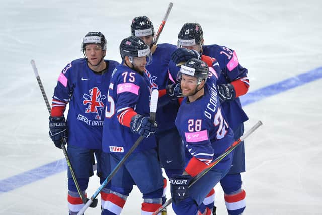 Brendan Connolly, far left, celebrates a goal in last month's World Championships in Riga. Picture: Dean Woolley.