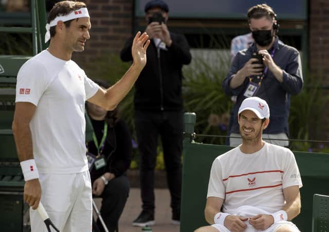 Practice time: Switzerland's Roger Federer, left, and Britain's Andy Murray on Court 14 for a practice session prior to  Wimbledon. (David Gray/Pool via AP)