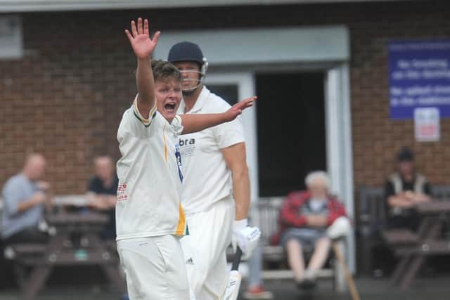 Victim: Pudsey St Lawrence's Charlie Parker celebrates after having Farsley's Mathew Lumb caught by Charlie Best for 1. Lumb was the fourth victim of Parker's five-wicket haul.
