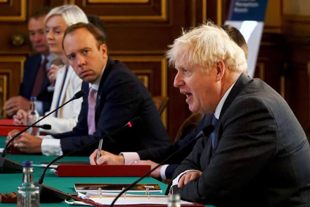 Boris Johnson with Cabinet ministers as Matt Hancock, the now ex-Health Secretary, looks on.