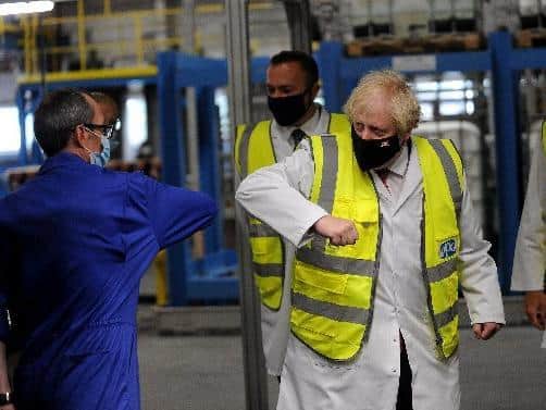 Prime Minister Boris Johnson pictured during his visit to PPG Architectural Coatings, Huddersfield Road, Birstall, West Yorkshire...Picture by Simon Hulme/Yorkshire Post..28th June 2021..