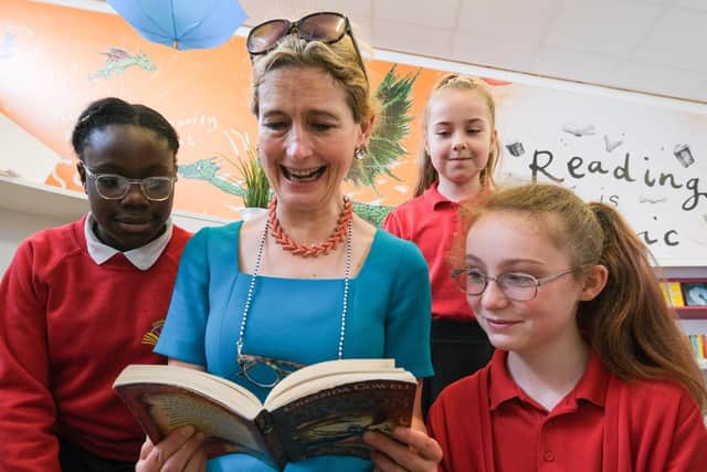 Children's Laureate Crssida Cowell MBE reading with pupils at Dinnington Community Primary School's new library. Picture: Dean Atkins