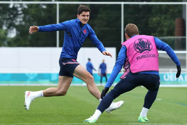IN THE FRAME: England's Harry Maguire and Harry Kane of England play tag at St George's Park Picture: Eddie Keogh/Getty Images
