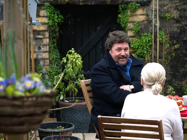 Michael sat in the garden reminiscing with his Auntie Denise over some tea and cakes. Picture: PA Photo/Wildflame Productions.