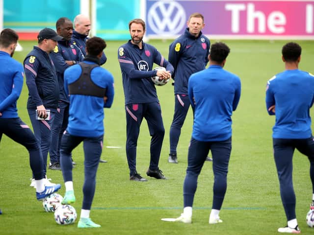 England manager Gareth Southgate speaks to his players during a training session at St George's Park