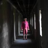 Tour guide David Allott in 'Bedlam', a corridor of bedrooms