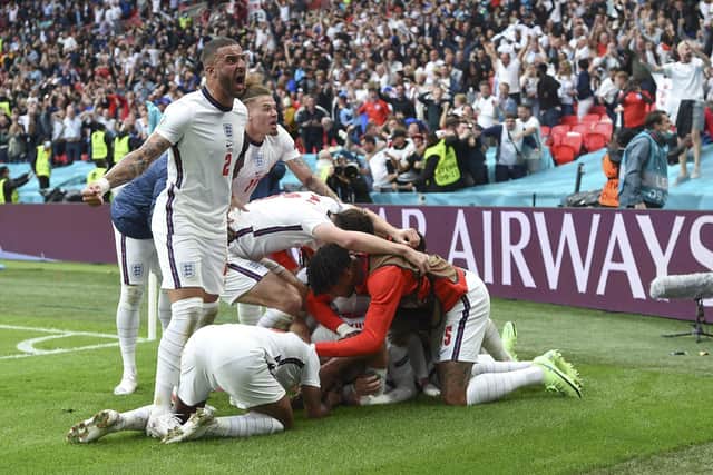England players celebrate after Harry Kane scored his side's second (Andy Rain, Pool via AP)