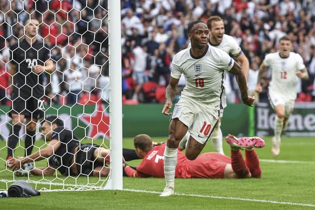 England's Raheem Sterling celebrates after scoring his side's opening goal at Wembley. (Andy Rain, Pool via AP)