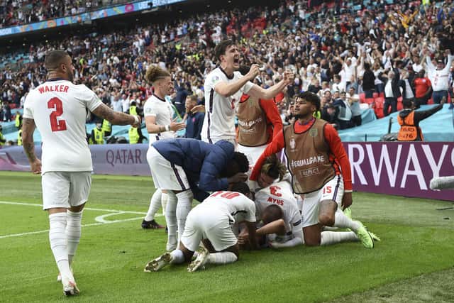 England players celebrate after Harry Kane scores his side's second goal during the Euro 2020 round of 16 match against Germany at Wembley. Picture: Andy Rain/AP