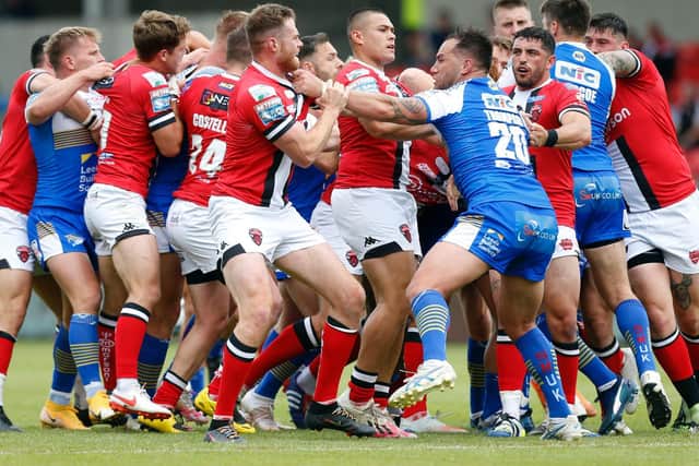 Leeds Rhinos' Boidene Thompson launches a punch against Salford Red Devils that led to his suspension. (Ed Sykes/SWpix.com)