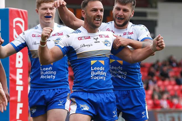 Leeds Rhinos' Luke Gale scores against Salford Red Devils but now serves a two-game ban. (Ed Sykes/SWpix.com)