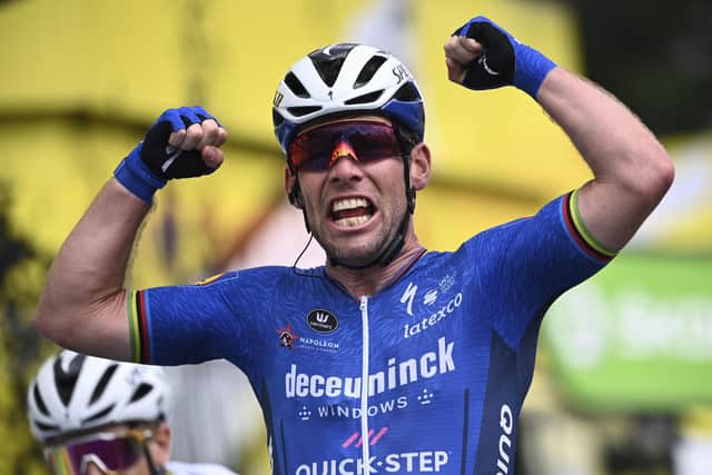 Mark Cavendish celebrates as he crosses the finish line to win the fourth stage of the Tour de France cycling race