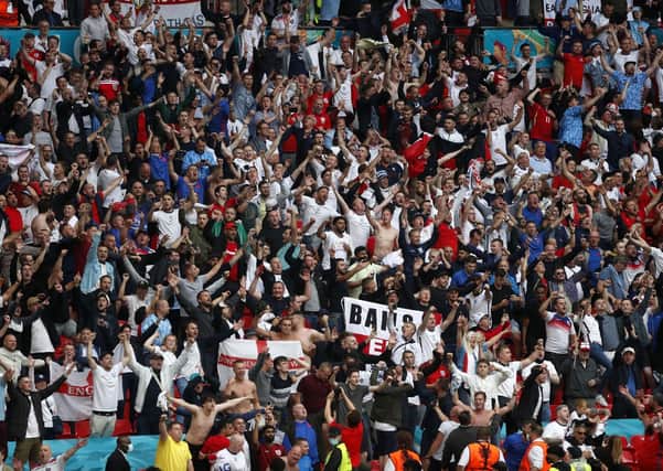 Back in the game: England fans cheer against Germany. Wembley capacities will increase for the semi-finals and final despite Covid-19 fears.