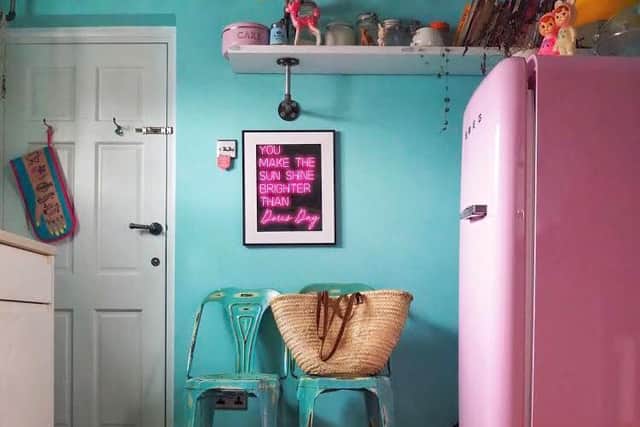 The kitchen in Joanne's favourite turquoise and pink