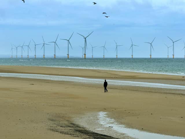 A man walks across the beach in Redcar. Picture: Jonathan Gawthorpe.