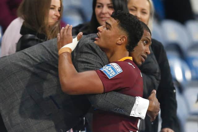 Will Pryce is congratulated by dad Leon Pryce after his Huddersfield Giants debut (ED SYKES/SWPIX)