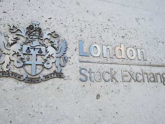Library image of a view of the London Stock Exchange sign in the City of London.