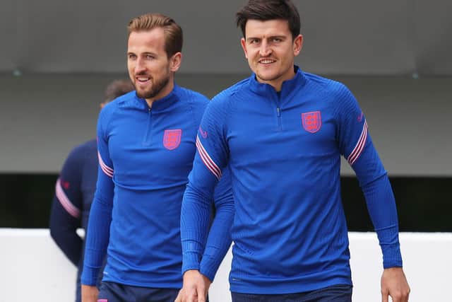 READY, WILLING AND ABLE: Harry Kane and Harry Maguire of England walk out prior to Friday's England training session at St George's Park. Picture: Catherine Ivill/Getty Images
