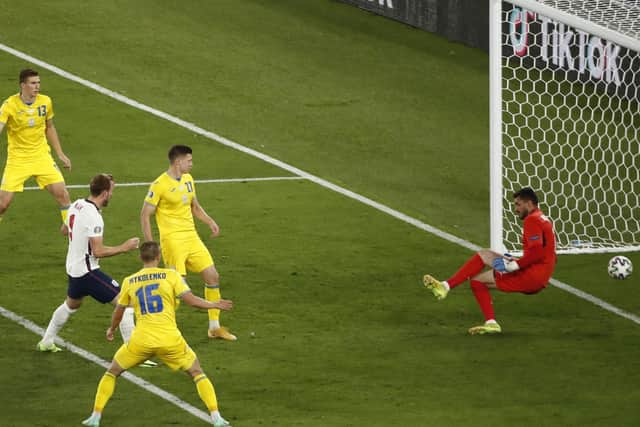 England's Harry Kane, second left, scores his side's third goal during the Euro 2020 soccer championship quarterfinal match between Ukraine and England at the Olympic stadium in Rome (Alessandro Garofalo/Pool Via AP)