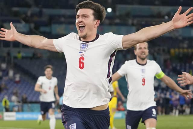 Sheffield-born Harry Maguire wheels away in celebration, with fellow goalscorer Harry Kane in the background, after doubling England’s lead with a thumping header in the quarter-final rout of the Ukraine in Rome. (Picture: AP/Alessandra Tarantino)