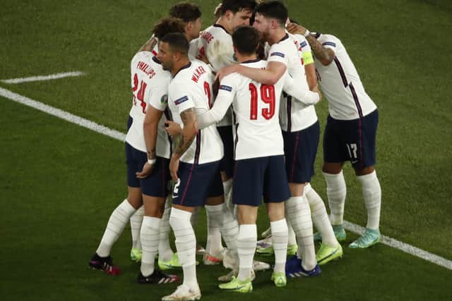 England players celebrate after Harry Kane scored his side's third goal during the Euro 2020 win over Ukraine. (Alessandro Garofalo/Pool Via AP)