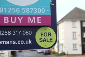 Library image of  a general view of a estate agent's board outside a house for sale