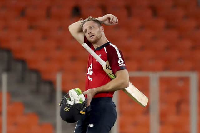 England's Jos Buttler walks off the field after their win in the third Twenty20 cricket match between India and England on March 16, 2021. (AP Photo/Aijaz Rahi)