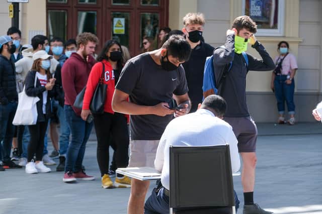 Students queue at The Crucible Theatre in Sheffield to get their Covid vaccinations. Picture: Dean Atkins