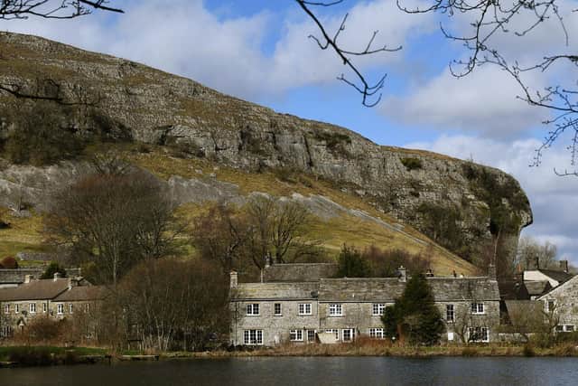 Kilnsey Park fishing lakes overlooked by Kilnsel Crag in the Yorkshire Dales
