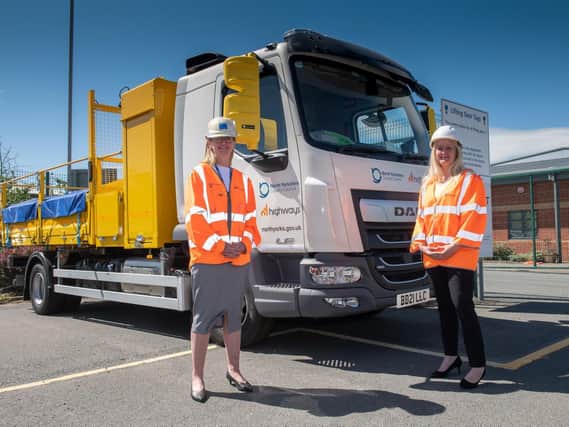 Jayne Charlton (left) and Melisa Burnham in front of a new NY Highways vehicle. The two women are now senior members of North Yorkshire County Council's highways team. (Photo: North Yorkshire County Council)