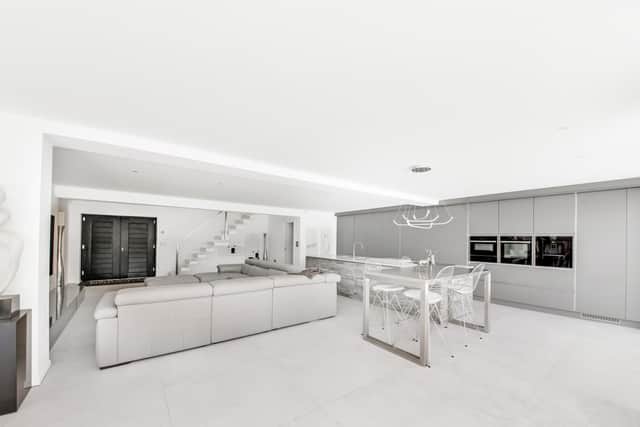 A neutral palette featuring soft greys gives this minimalist home a great sense of calm