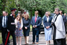 Lord Lieutenant of West Yorkshire Ed Anderson (second left) and Reverend Dr Jonathan Pritchard (right), greet relatives of Captain Sir Tom Moore