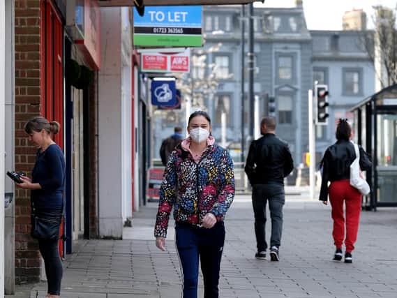 A woman wears a face mask in Scarborough. Picture: Richard Ponter.