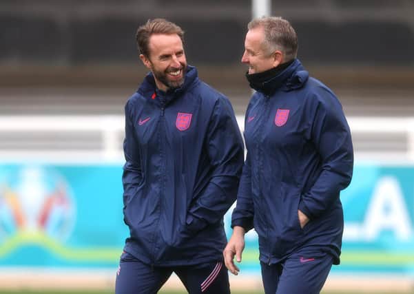 England manager Gareth Southgate and goalkeeping coach Martyn Margetson talk during training at St George's Park. (Photo by Catherine Ivill/Getty Images)
