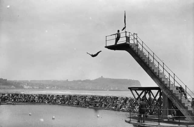 circa 1929:  Crowds watching the platform diving at Scarborough, Yorkshire.  (Photo by Alfred Hind Robinson/A H Robinson/Hulton Archive/Getty Images)