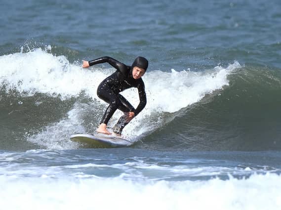 Jensen was first put on a foamboard aged two by his dad Pics: Richard Ponter